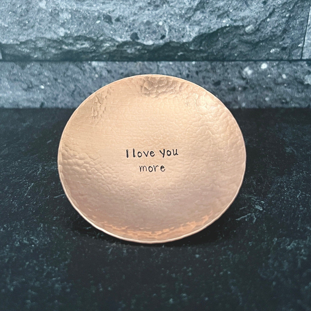 handmade hammered copper ring dish. Dish shown has a personalized message hand stamped in the center of the dish. Personalize your dish with your message in the center and/or along the top and bottom rim.