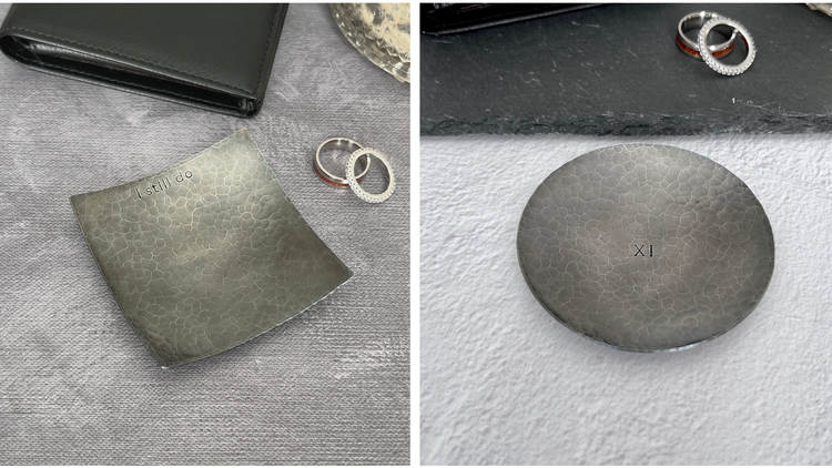 Handcrafted steel ring dishes for the 11th anniversary, hammered and hand darkened in South Carolina. Images show square hammered dish with I still do on top rim and a round dish with XI stamped in the center.