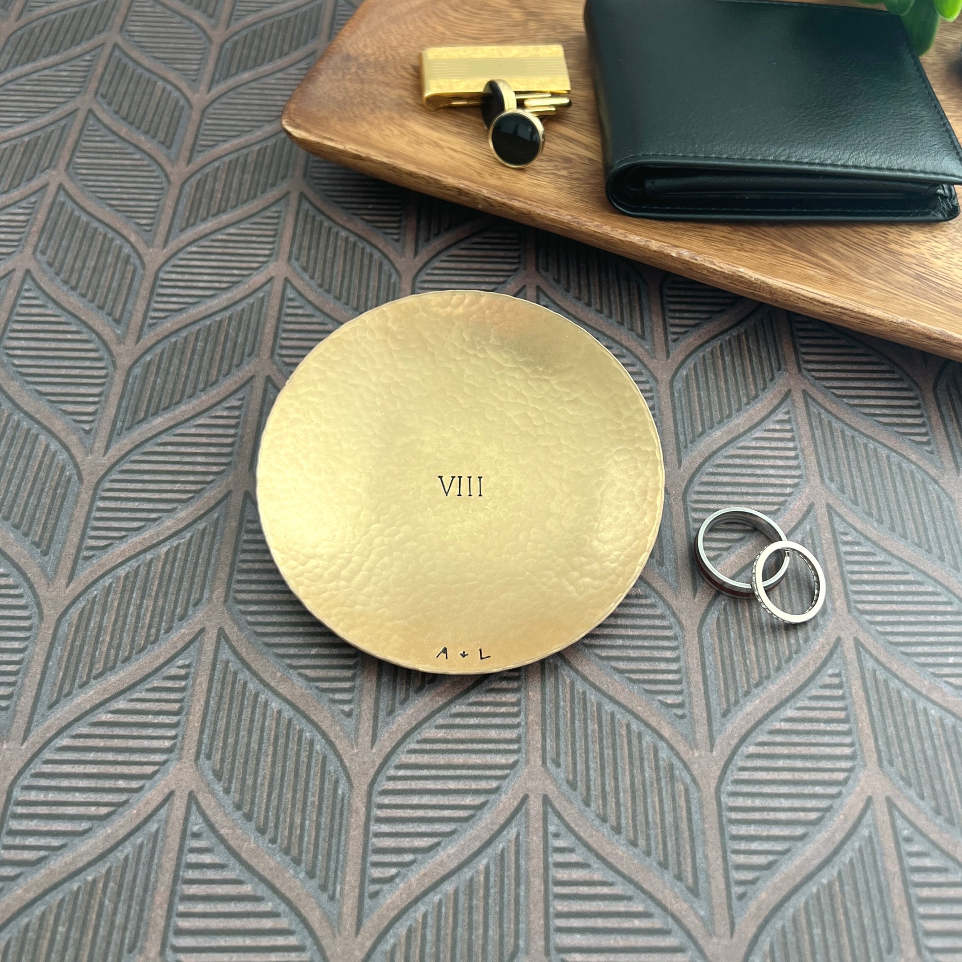 Personalized bronze ring dish with custom hand-stamped text, handcrafted and hammered in South Carolina