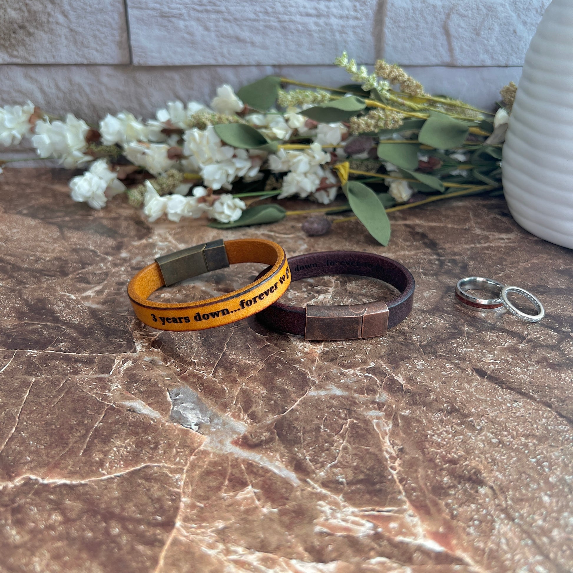 Custom engraved caramel and mahogany leather bracelet with antique bronze magnetic clasp, personalized with laser engraving
