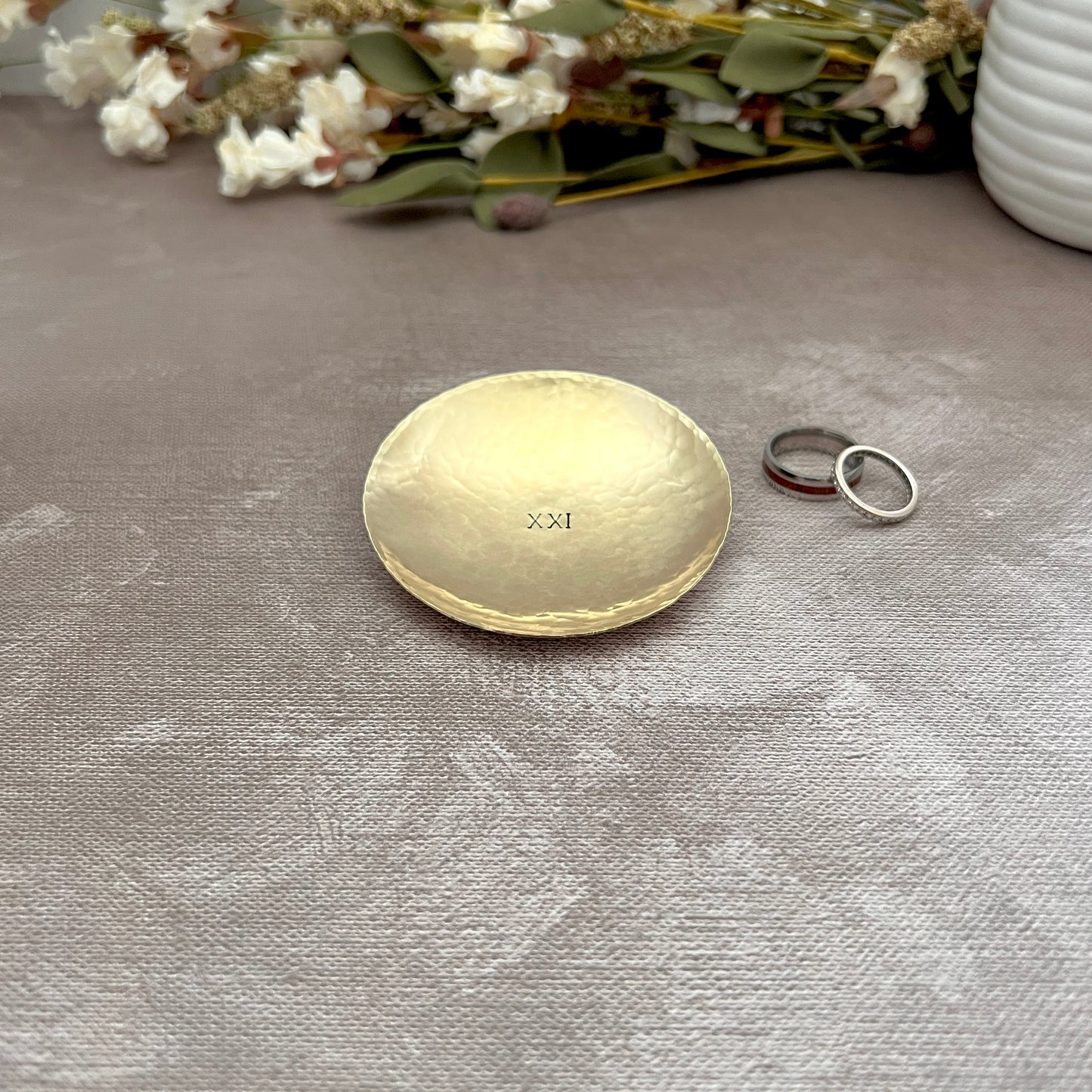 Personalized round brass ring dish with custom hand-stamped text, handcrafted and hammered in South Carolina