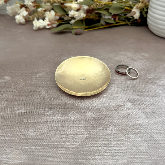 Personalized round brass ring dish with custom hand-stamped text, handcrafted and hammered in South Carolina