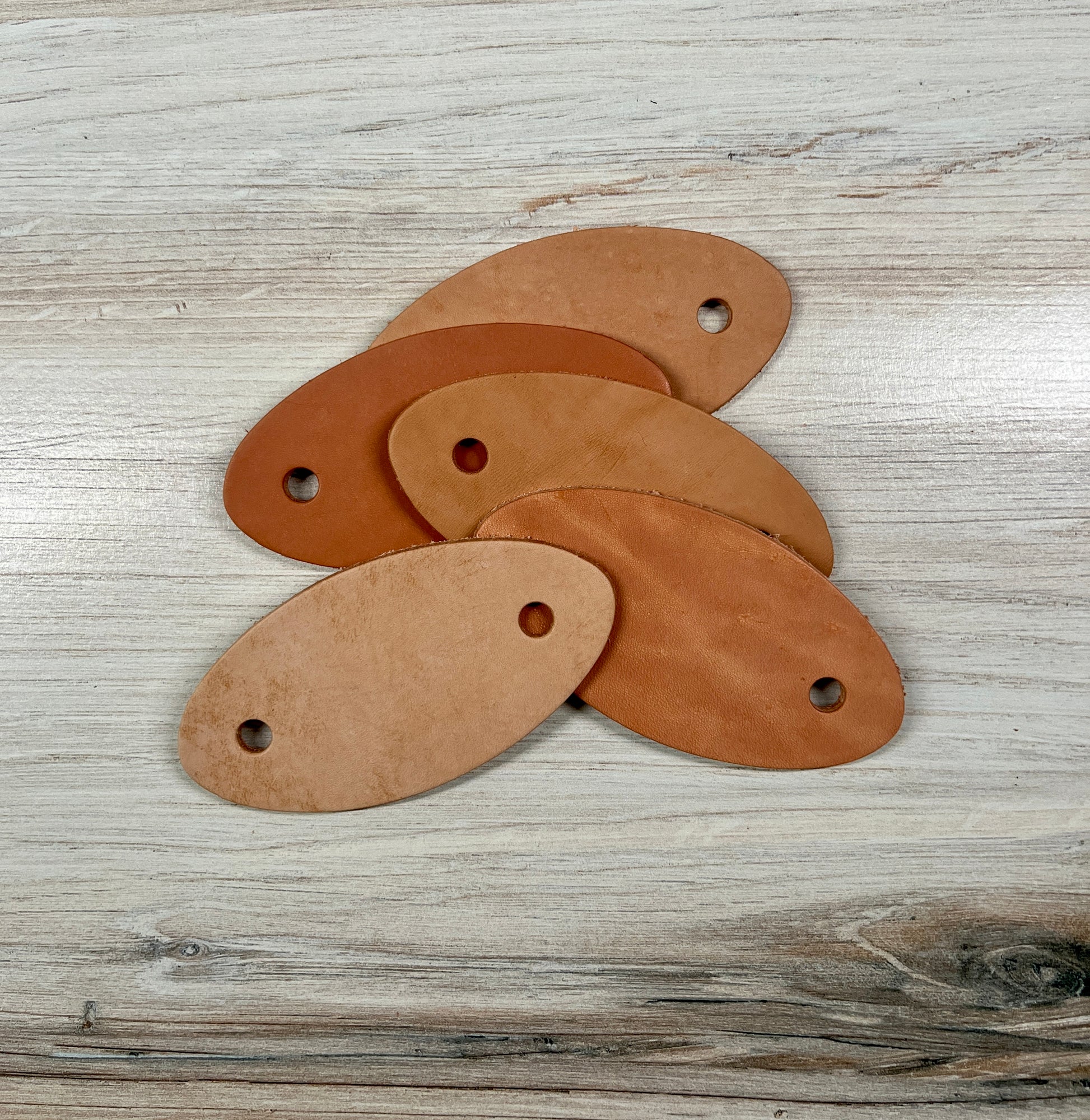 group of veg tanned leather barrette blanks 
